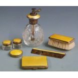 Five yellow guilloché enamel silver mounted dressing table items, comprising atomiser marked