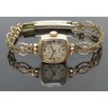 Everite 9ct gold ladies wristwatch with black hands, Roman numerals and silver dial, on gold