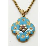 An early Victorian pendant set with aqua coloured enamel, a central ruby and seed pearls, with glass