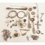 A collection of silver jewellery including bangles, fruit knife, filigree brooch, charms,