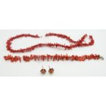 A coral necklace, bracelet and a pair of 9ct gold earrings set with coral