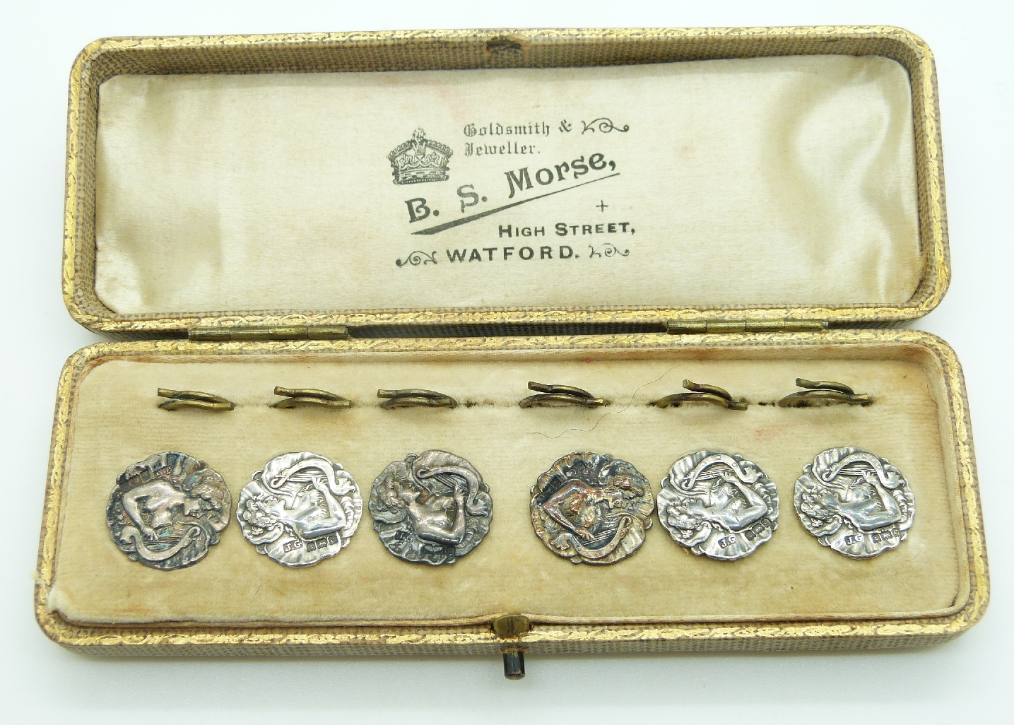 A boxed set of Edwardian silver buttons depicting a lady playing a harp, Birmingham 1903, maker