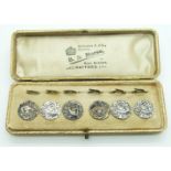 A boxed set of Edwardian silver buttons depicting a lady playing a harp, Birmingham 1903, maker