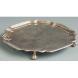 George V Goldsmiths & Silversmiths Company hallmarked silver salver with shaped edge and raised on