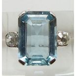 Art Deco platinum ring set with an emerald cut aquamarine measuring approximately 8.7ct and two