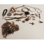 A collection of silver jewellery including earrings, pendants, Victorian brooches, brooches, cameo