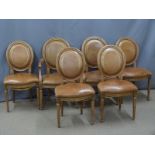 A set of six (4+2) French style leather upholstered dining chairs