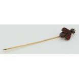 Victorian stick pin in the form of a fly set with Bohemian rose cut garnets