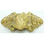 Art Nouveau gilt buckle depicting a lady picking flowers