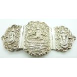 Indian white metal three piece buckle with central scene of a god atop a mythical creature, marked