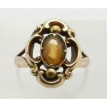 A 9ct gold ring set with an oval citrine, 2.8g, size L