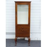 A mahogany display cabinet with glazed door, drawer and drop front compartment, on cabriole legs