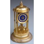 German brass anniversary clock with six reeded columns, blue enamelled dial and contrasting white