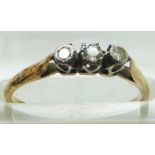A yellow metal ring set with three diamonds, in original box, size N, 1.9g