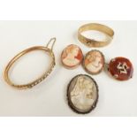 Three cameo brooches, a gold plated bangle and a Victorian gold plated bangle set with paste