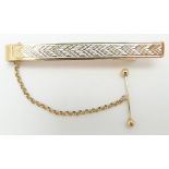 A 9ct gold tie clip with textured decoration, 7.6g