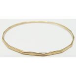 A 9ct gold bangle, 6.6g