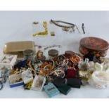 A large collection of costume jewellery including beads, brooches, watches, scarab beetle