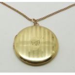 A 15ct gold locket (10g) and 9ct gold chain (4.1g)