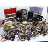A collection of costume jewellery including beads, brooches etc
