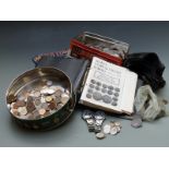 A collection of UK and overseas coins, some silver, together with 2002 World Coins book and a