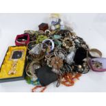 A large collection of costume jewellery including bangles, beads etc