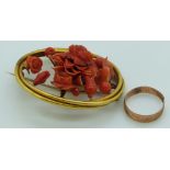 A yellow metal 19thC brooch set with carved coral and a 9ct gold ring