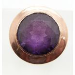 A 9ct rose gold ring set with a synthetic purple sapphire, 6.8g, size N