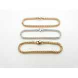 A set of three tri-coloured 18ct gold bracelets by Fope, 33.2g