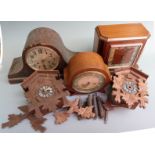 A group of clocks for the restorer to include two German cuckoo clocks and three circa 1930's mantel