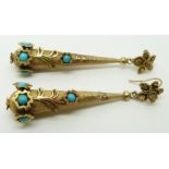 A pair of early Victorian earrings of textured tear drop form with applied floral decoration, set