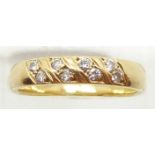 An 18ct gold ring set with diamonds, 4.3g, size O