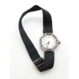 A 9ct white gold Art Deco ladies watch, the octagonal face set with baguette cut Montana sapphires