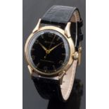 Bulova gold plated gentleman's automatic wristwatch with gold hands and Arabic numerals, black