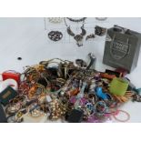 A collection of costume jewellery including beads, bangles, watches etc