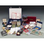 A large collection of cased commemorative coins and medal coins together with a quantity of