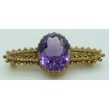 Edwardian 15ct gold brooch set with a large oval cut amethyst and seed pearls, 4.7g