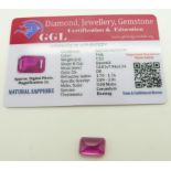 A loose emerald cut pink sapphire measuring approximately 7.5ct