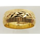 An 18ct gold wedding band with textured decoration, size N, 5.6g.