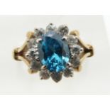 A 9ct gold ring set with blue topaz and cubic zirconia, 3.4g, size K