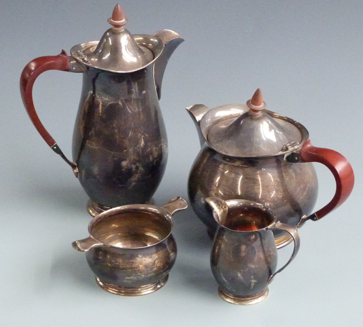 Retro hallmarked silver four piece teaset with Art Nouveau influenced design and stained wooden