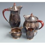 Retro hallmarked silver four piece teaset with Art Nouveau influenced design and stained wooden