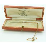 A 15ct gold and platinum brooch set with a pearl in a Goldsmiths and Silversmiths Company box