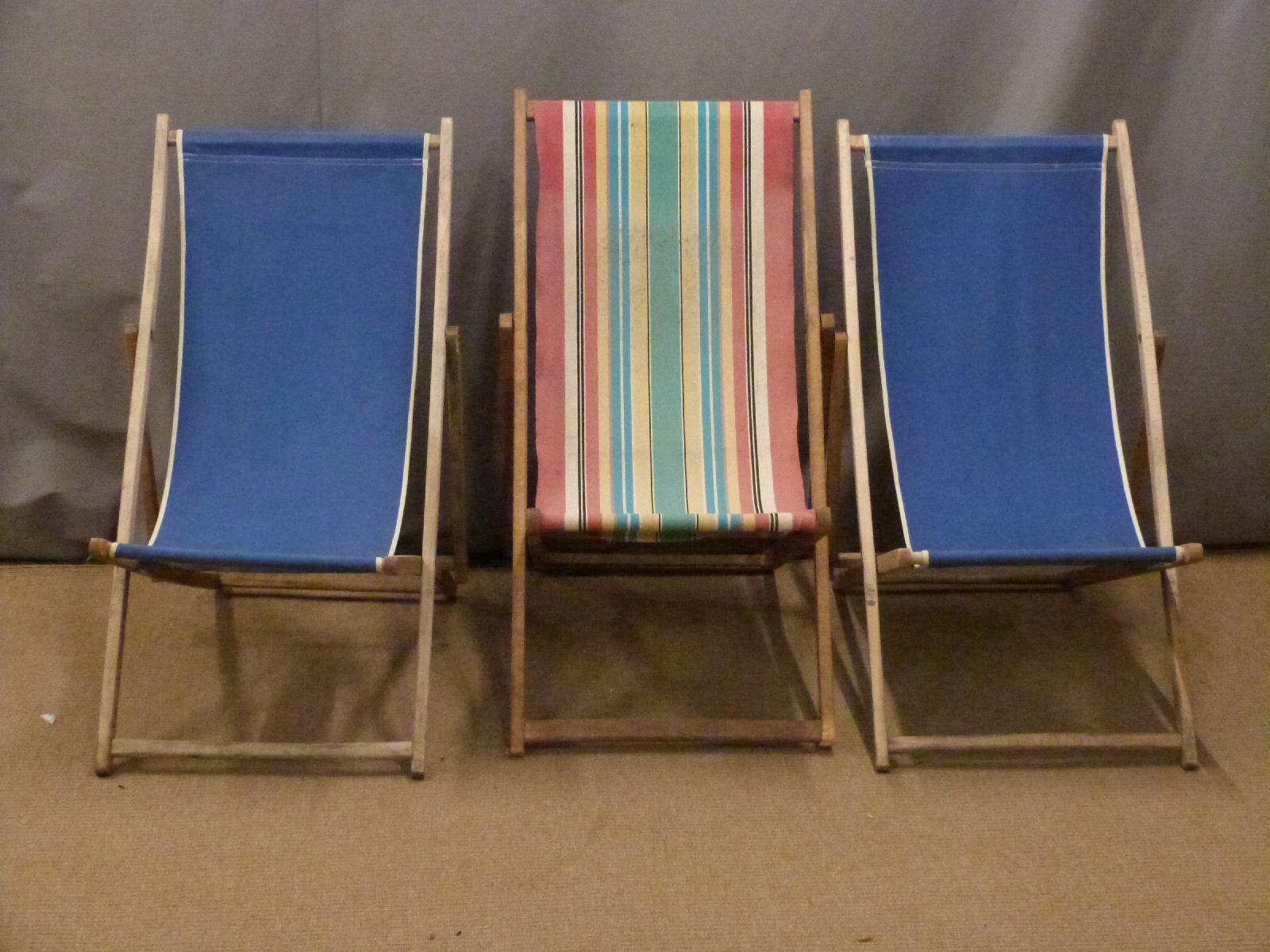 Three vintage deck chairs.