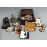 19thC bronze bell, mineral samples including raw amber, spirit flask, badges, stopwatch, Negretti