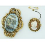 Victorian brooch set with a Limoges plaque depicting a ship together with a cameo brooch