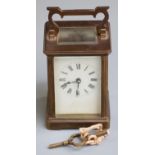 Brass cased carriage clock with Roman dial, 11cm tall