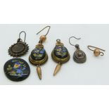 A pair of Victorian earrings set with floral plaques and two unmatched silver Victorian earrings