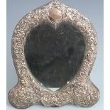 Victorian hallmarked silver heart shaped dressing table mirror with embossed frame decorated with