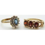 A 9ct gold ring set with three garnets and a 9ct gold ring set with a topaz, 4.3g, size M